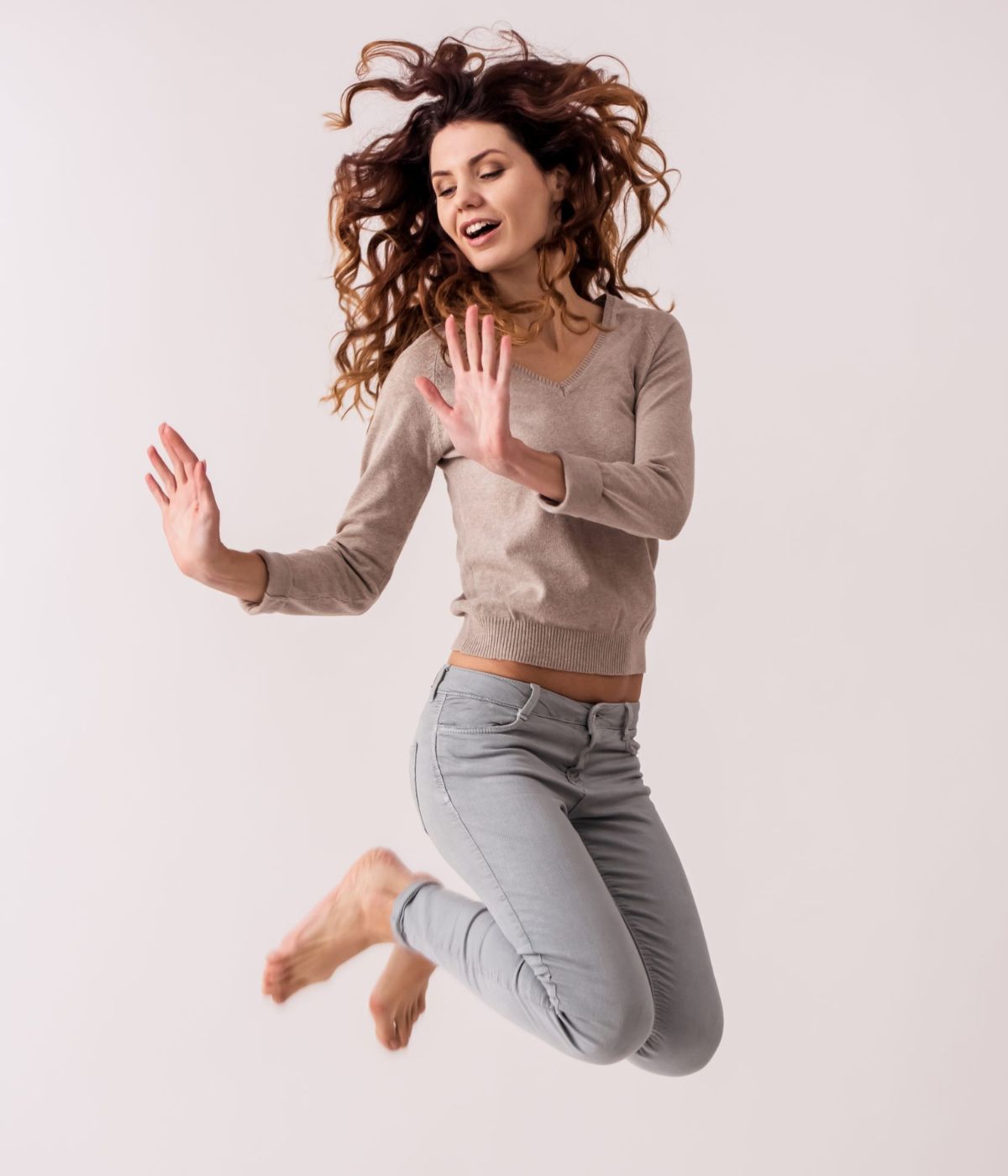 A woman mid-movement, energetic and light